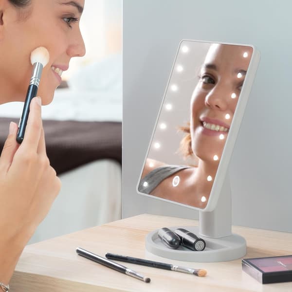 This touch-sensitive LED table mirror illuminates your face for perfect makeup application and features an LED mirror function (white).