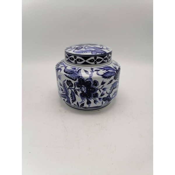 Cute porcelain jar with lid and hand painted pattern