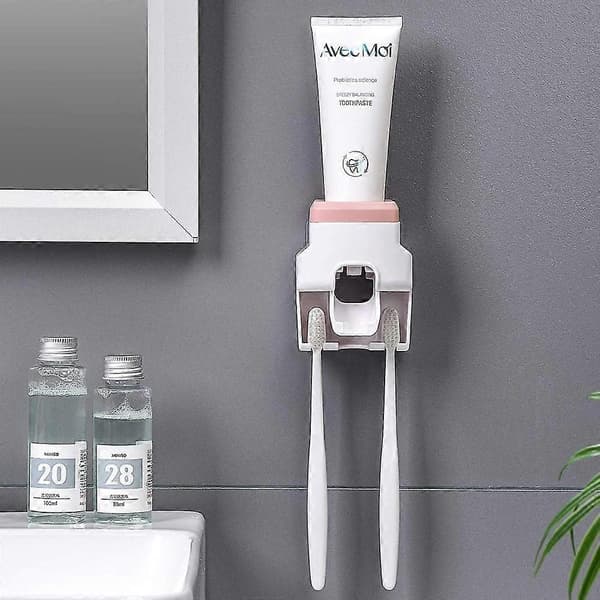 Automatisk tandpastadispenser og tandbørsteholder (pink)