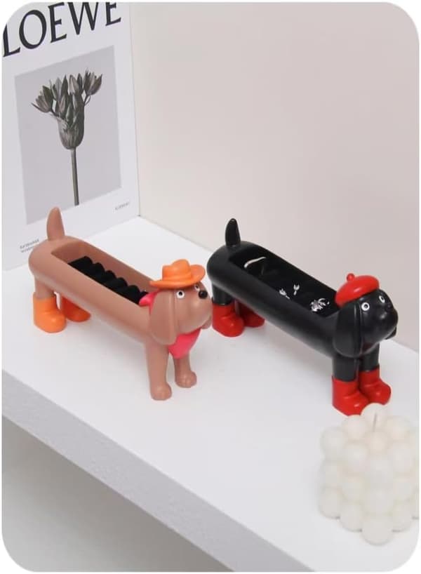 Sød gravhundformet opbevaringsboks i harpiks (sort).