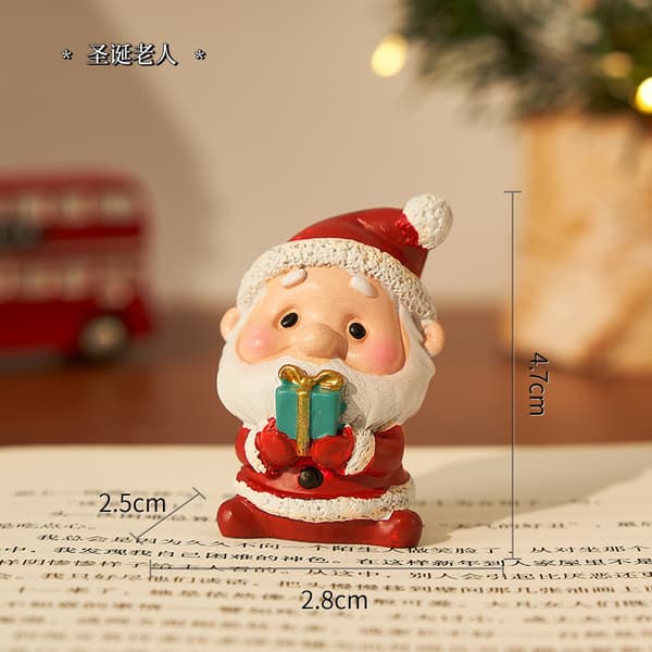 Julhartsfigurset med presentförpackning, tomte, snögubbe och renar som bordsdekoration för julklapp Christmas bear