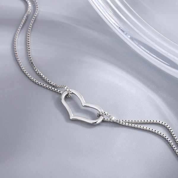 Dobbelt justerbart sølvarmbånd med udskåret hjerte