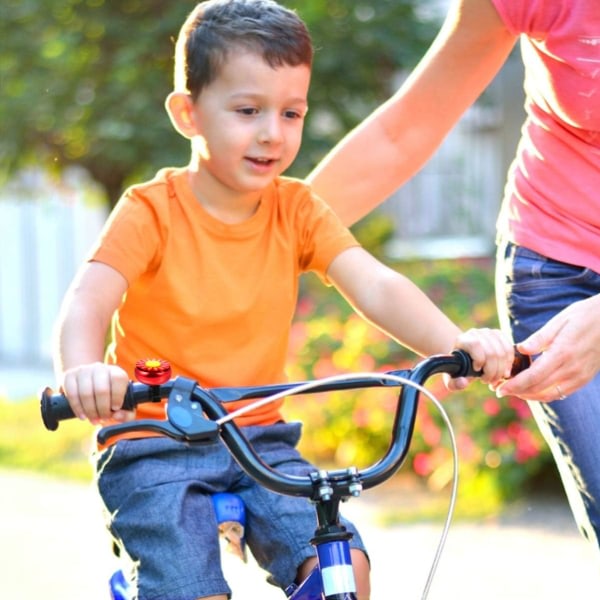 Sykkelklokke for barn Pojkar Flickor Solrosformad sykkelklokke med høyljudd ringsignal Barncykelklocka Roliga sykkeltilbehør Lätt att festa (rød)