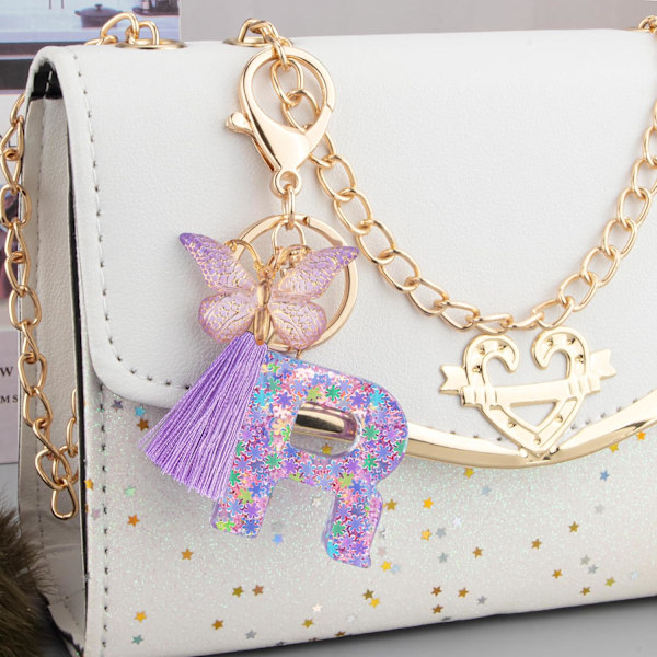 Sööt roosad võtmehoidjad naistele ja tüdrukutele, algustähega võtmehoidjad tutiga, ripatsid võtmetele, rahakotile, käekottidele ja seljakottidele Purple Butterfly Letter-r