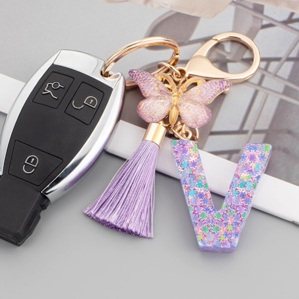Sööt roosad võtmehoidjad naistele ja tüdrukutele, algustähega võtmehoidjad tutiga, ripatsid võtmetele, rahakotile, käekottidele ja seljakottidele Purple Butterfly Letter-v