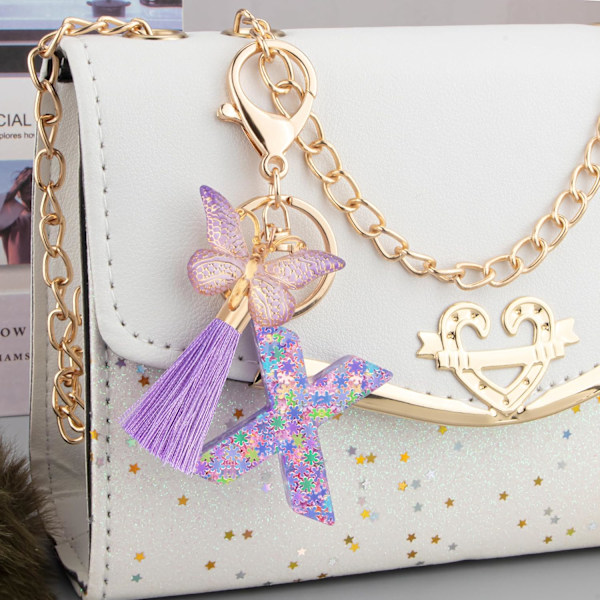 Sööt roosad võtmehoidjad naistele ja tüdrukutele, algustähega võtmehoidjad tutiga, ripatsid võtmetele, rahakotile, käekottidele ja seljakottidele Purple Butterfly Letter-x