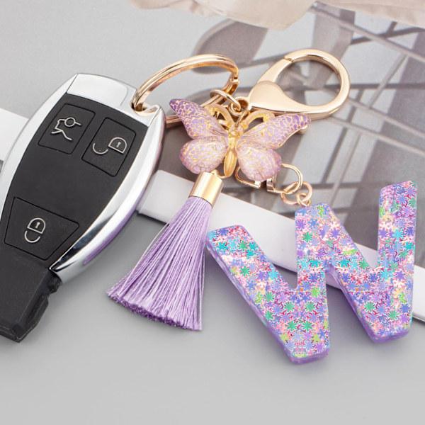 Sööt roosad võtmehoidjad naistele ja tüdrukutele, algustähega võtmehoidjad tutiga, ripatsid võtmetele, rahakotile, käekottidele ja seljakottidele Purple Butterfly Letter-w