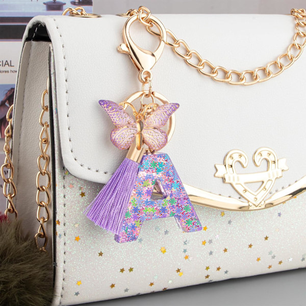 Sööt roosad võtmehoidjad naistele ja tüdrukutele, algustähega võtmehoidjad tutiga, ripatsid võtmetele, rahakotile, käekottidele ja seljakottidele Purple Butterfly Letter-a