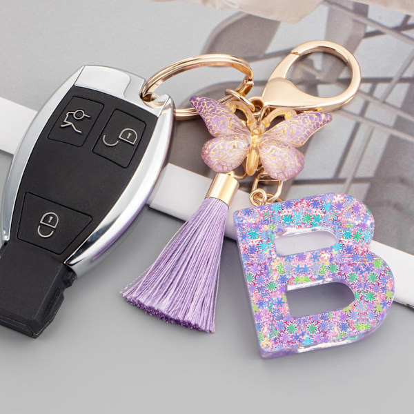 Sööt roosad võtmehoidjad naistele ja tüdrukutele, algustähega võtmehoidjad tutiga, ripatsid võtmetele, rahakotile, käekottidele ja seljakottidele Purple Butterfly Letter-b