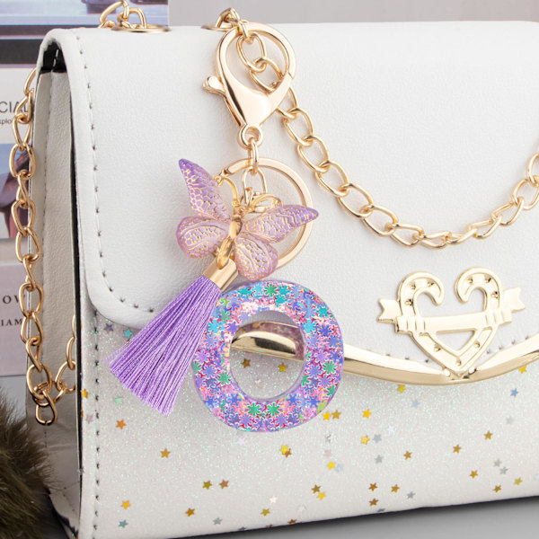 Sööt roosad võtmehoidjad naistele ja tüdrukutele, algustähega võtmehoidjad tutiga, ripatsid võtmetele, rahakotile, käekottidele ja seljakottidele Purple Butterfly Letter-o