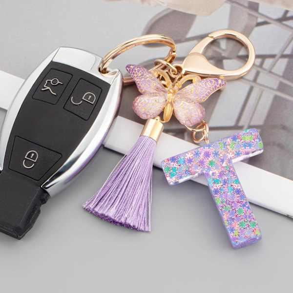 Sööt roosad võtmehoidjad naistele ja tüdrukutele, algustähega võtmehoidjad tutiga, ripatsid võtmetele, rahakotile, käekottidele ja seljakottidele Purple Butterfly Letter-t