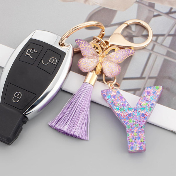 Sööt roosad võtmehoidjad naistele ja tüdrukutele, algustähega võtmehoidjad tutiga, ripatsid võtmetele, rahakotile, käekottidele ja seljakottidele Purple Butterfly Letter-y