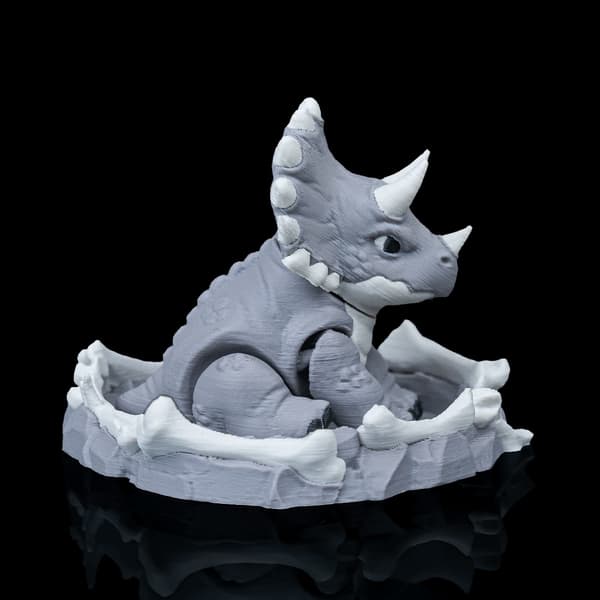 Dinosaurie Fidget-leksaksfigur med bo | Dini Mini Dino grå M