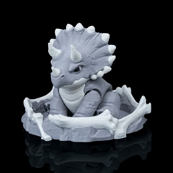 Dinosaurie Fidget-leksaksfigur med bo | Dini Mini Dino grå M