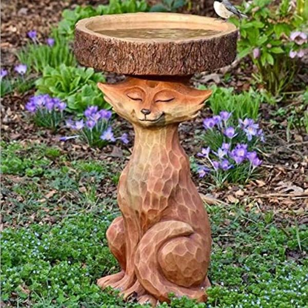 Hageskulptur. Morsomme revehunder leker fritt i hagen, egnet