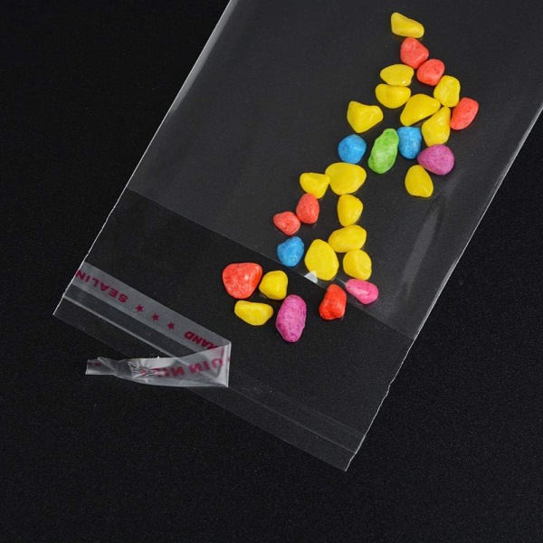 100 små genomskinliga godispåsar i plast, självhäftande glaspapp