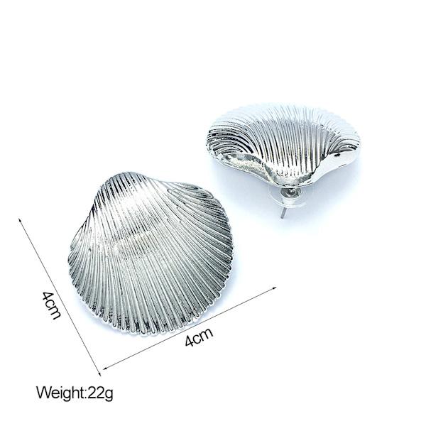 Store chunky gullringer i gull, store minimalistiske øredobber