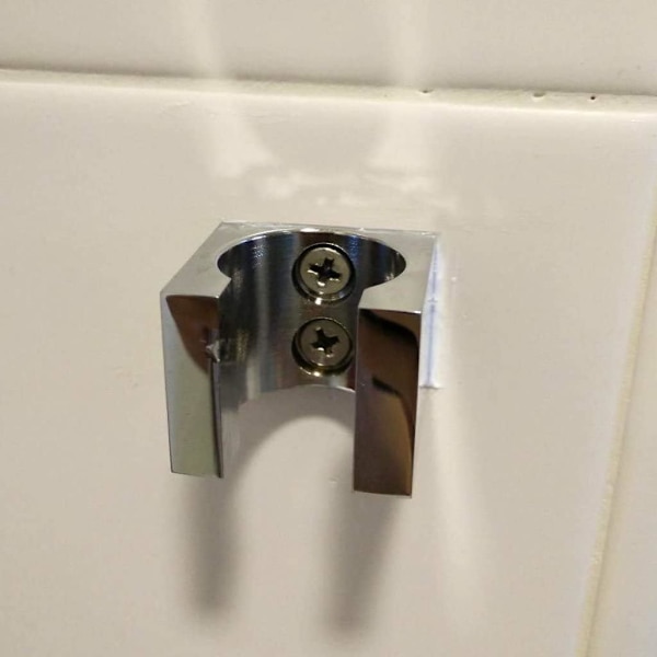 Väggmonterad duschhuvudhållare i massivt mässing
