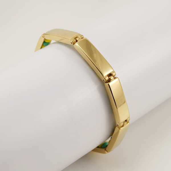 Armband i rostfritt stål med gröna och gula pärlor