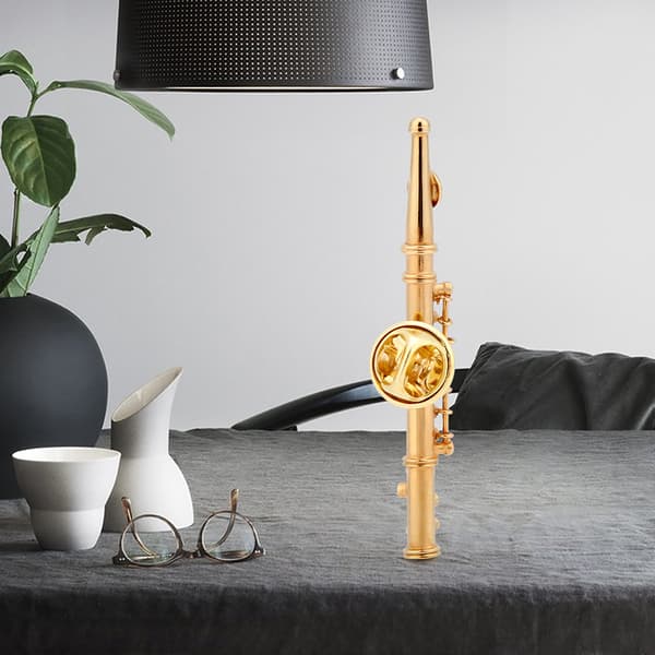 Fløjteformet musikinstrument Brosche til samling af gaver (guld)