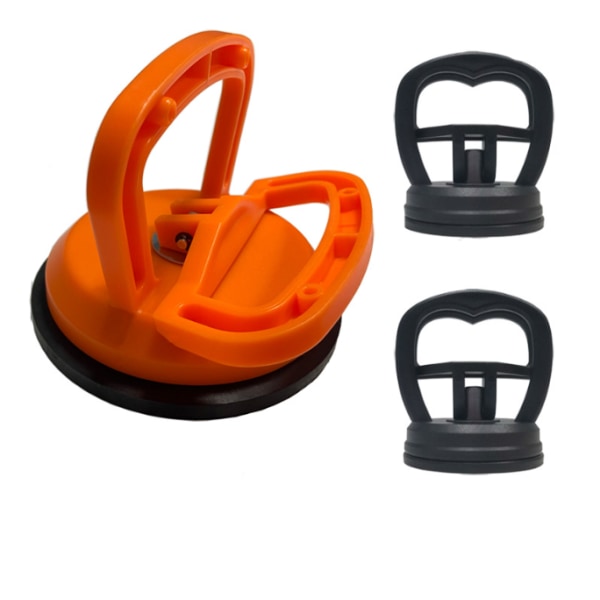 En stor og to små glasflisesugekopper En klo plastiksugekopper Reparation af bilbuler