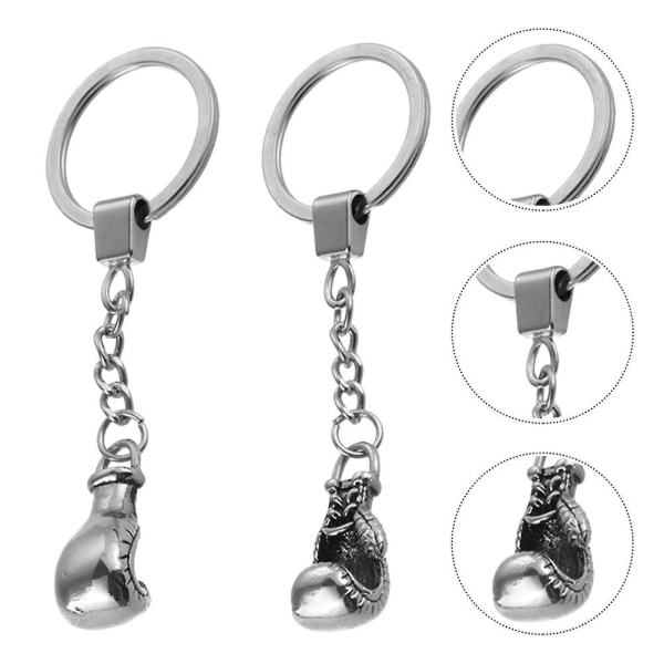 2kpl Tyylikäs nyrkkeilyhansikas avaimenperät metalliset nyrkkeilyhansikkaat avaimenperät (satunnainen tyyli)