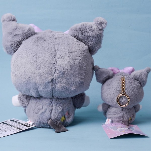 Suloinen sarjakuva Kulomi pehmonukke, pehmotäytetty lelu 23CM Doll Cinnamoroll