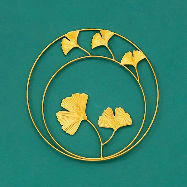 Gyldne jernvægskulptur i form af et Gingko-blad, Ahornblad, Skildpaddeblad, Palmeblad, Cannablad