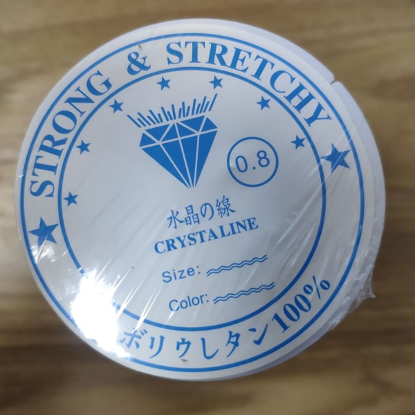 Pakke med 2 klar strekktråd for smykker 0,8 mm
