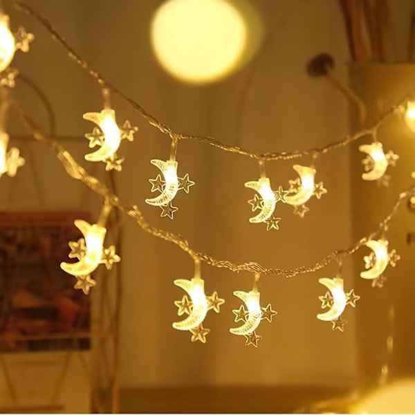 Silikoninen tonttuvalojen ketju loma-asuntojen koristeluun Tähti ja kuu, lämpimät värit. Star and moon, warm colors. 10 m100lamps plug-in version