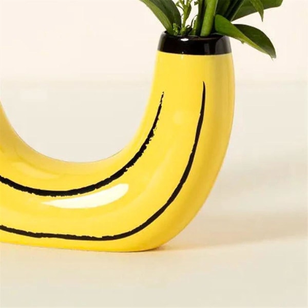 Enkel bananvase blomsterarrangement stue spisestue dekoration ornamenter harpiks artefakt potteplante med ramme