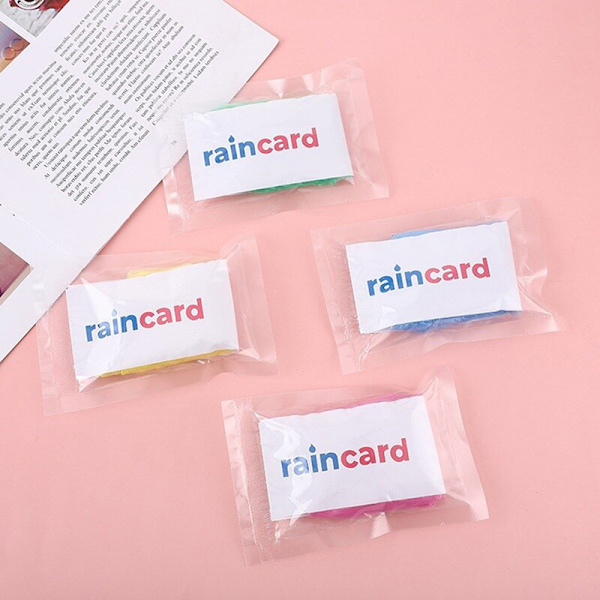 2/5st Bärbar Regnrock Kvinnor Män Utomhus Regnkläder Engångs 5PCS
