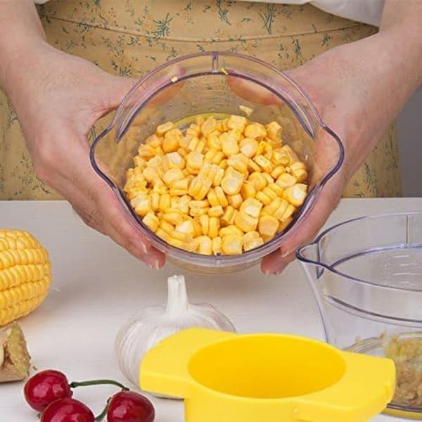 Maiskolbe-skreller med integrert blad i rustfritt stål og målebeger