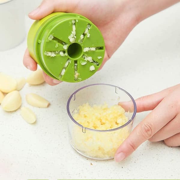 Garlic press with storage jar for nuts and peanuts