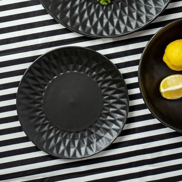 Sort keramik desserttallerken med dekorative mønstre