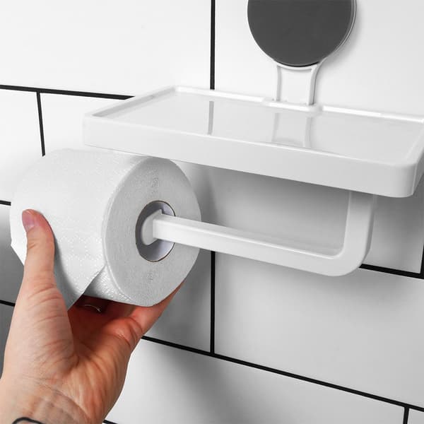 WC-paperiteline imukuppihyllyllä