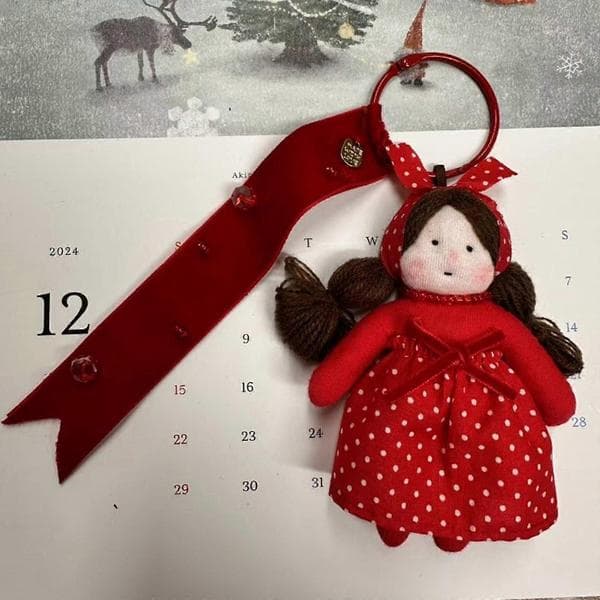 Red plush doll keychain, portable key holder with strap, festive accessory for bags and keys