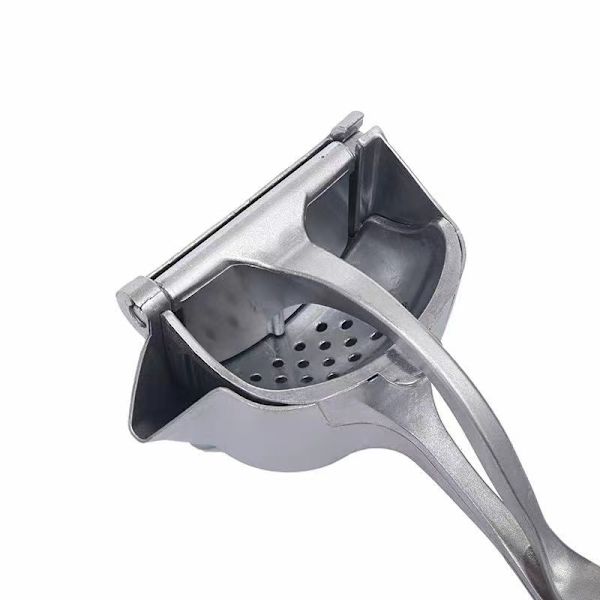 Liten manuell juicepress i silver, aluminiumlegering, för babyfrukt