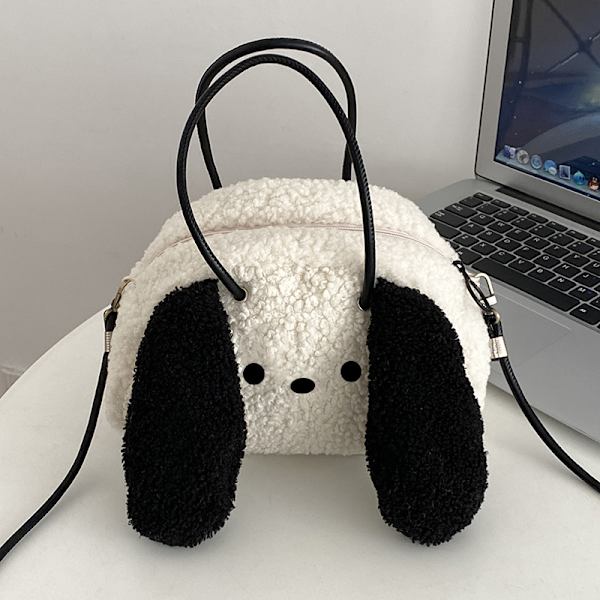 Kiharakarvainen koira, jolla on isot korvat, crossbody-reppu, söpö gi