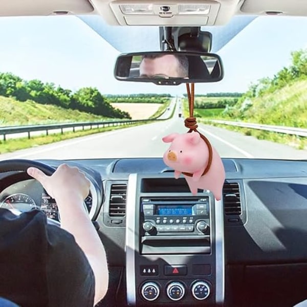 Den rosa grisen, bilhängande prydnad bilspegel hängande bil