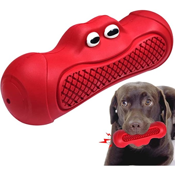 Punainen tuhoutumaton koiranlelu, jossa isot koiran silmät, koiran purulelu, lähellä