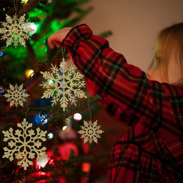 36 st gyllene snöstjärnedekorationer i plast med glitter