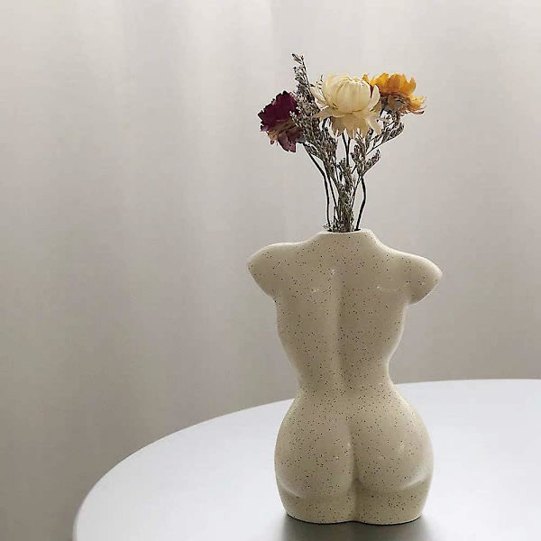 Kvinnelig kroppsform vase, skulptur formet som en kropp, søt knoppblomst