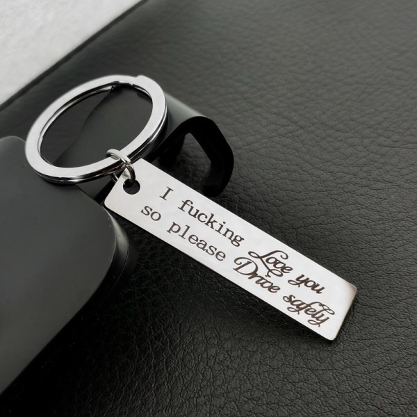 En silver 12x50 mm nyckelbricka, säker körning av nyckelbrickor