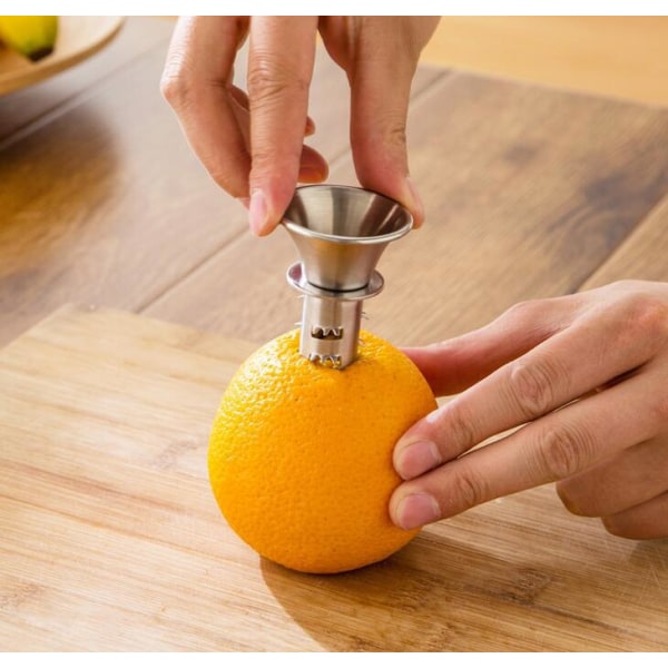 Käytännöllinen ruostumattomasta teräksestä valmistettu appelsiini-sitruuna-lime-mehupuristin käsin