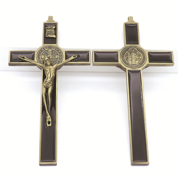 Metall som lyser i mörkret korsfigur Jesus korsfäst kristen katt