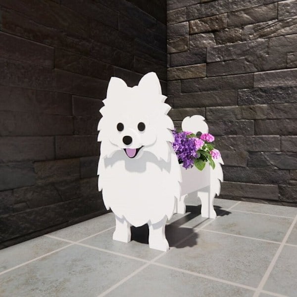 Pomeranian-koiran kukkaruukku lemmikkikoiran kukkaruukku ihana lemmikkikasvien puutarhakoriste
