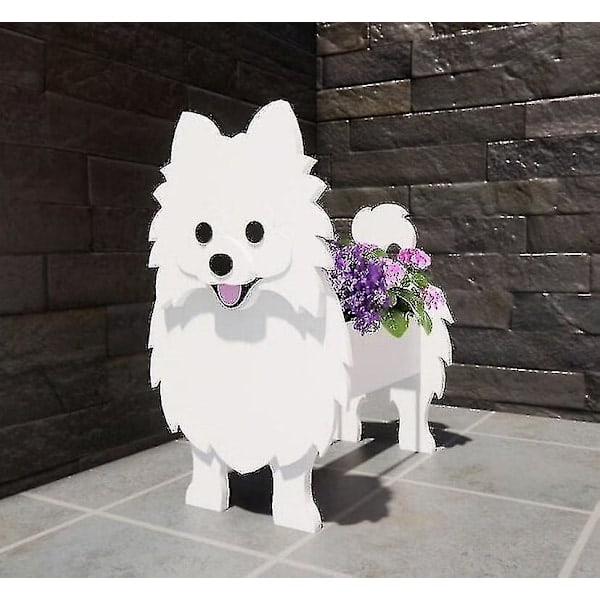 Pomeranian-koiran kukkaruukku lemmikkikoiran kukkaruukku ihana lemmikkikasvien puutarhakoriste