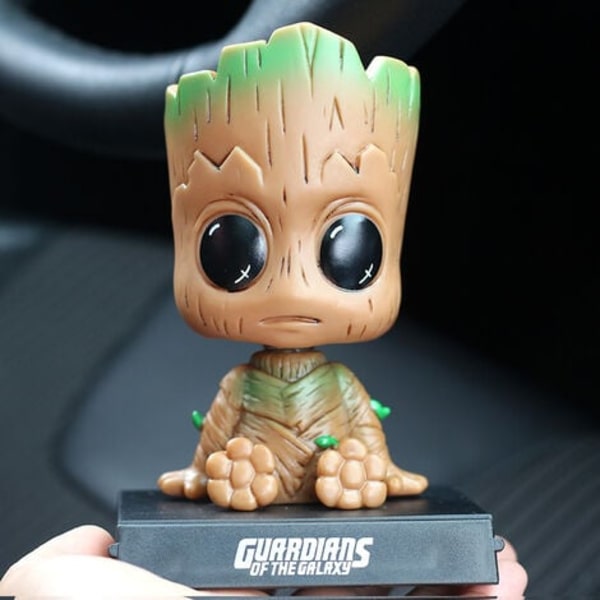 Groot-hahmon sarjakuva-autokojelaudan keinuva nukkehahmo Söpö anime Groot -auton lisävarusteet