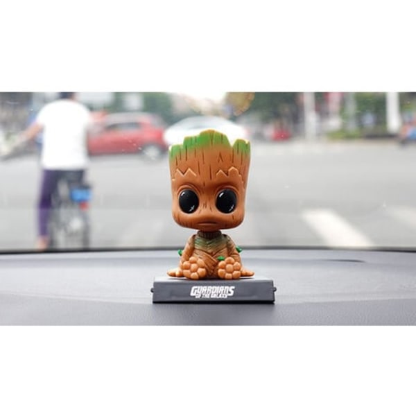 Groot-hahmon sarjakuva-autokojelaudan keinuva nukkehahmo Söpö anime Groot -auton lisävarusteet